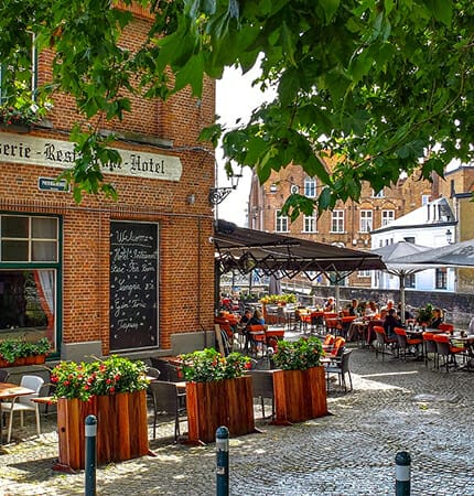 popular local restaurant with flowers in brugge belgium