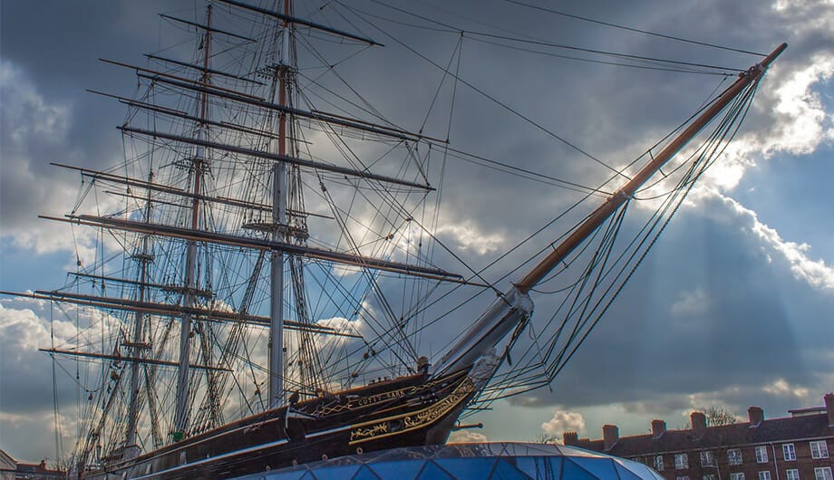 The bow of the Cutty Sark with a cloudy sky background in London