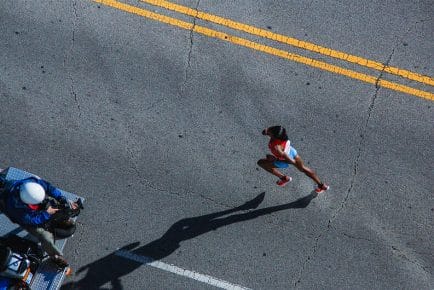 Runner on marathon race course
