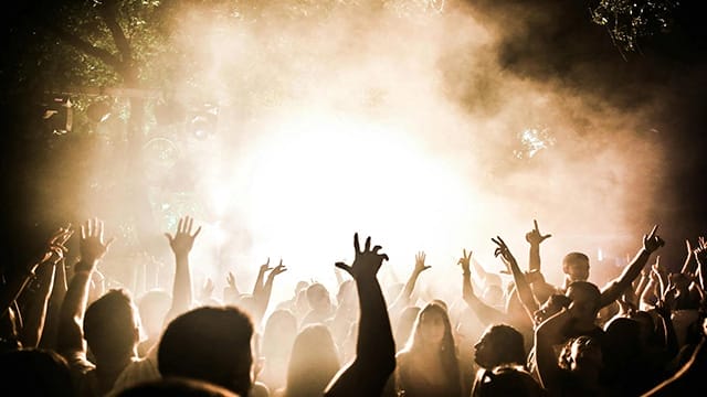 fans waving official tickets for a popular copenhagen concert at royal arena