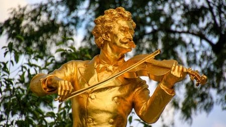 golden statue of famous austrian violin performer in vienna austria