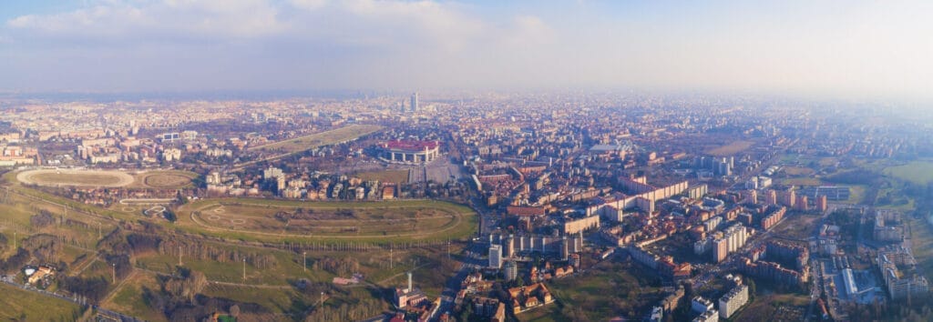 Panoramic view of Milan (Italy), south west area, with racecourse, Trenno park and Meazza stadium (San Siro)