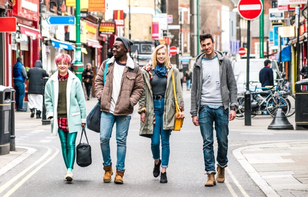 Students walking on Brick Lane center at Shoreditch London