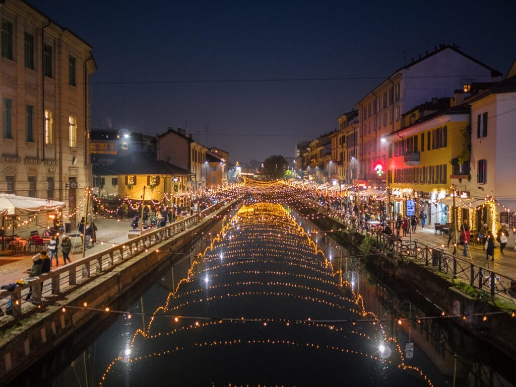 Lights on canal during popular Italian holiday festival in Milan.